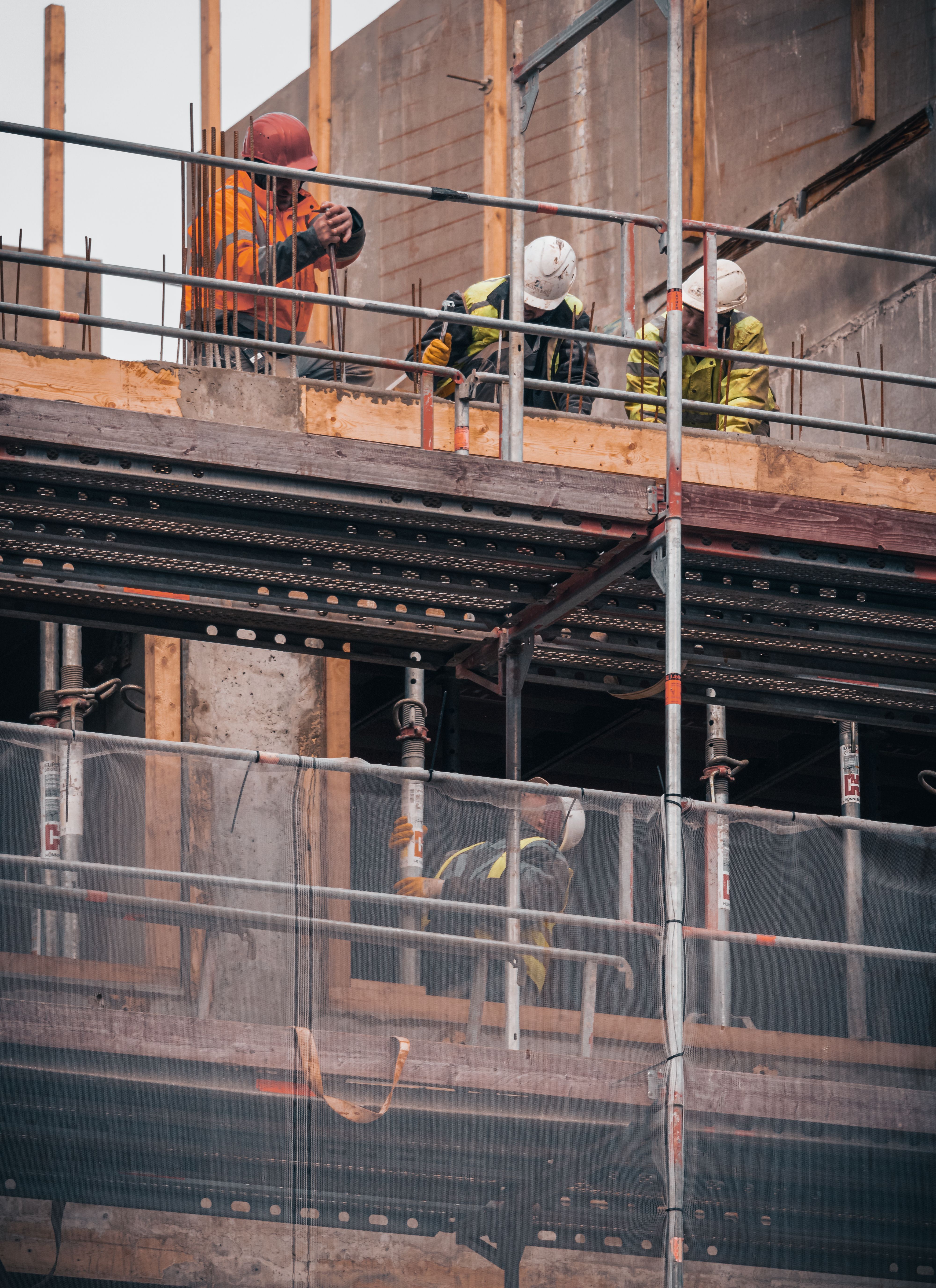 Construction workers on scaffolding
